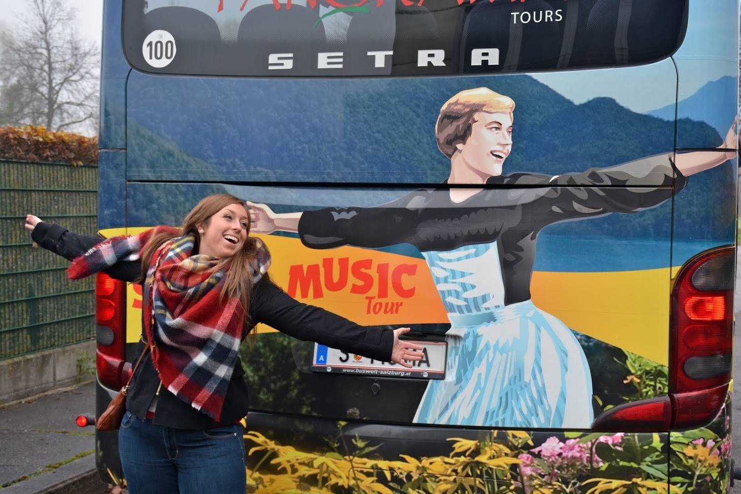 Girl in front of a Sound of Music tour bus in Salzburg